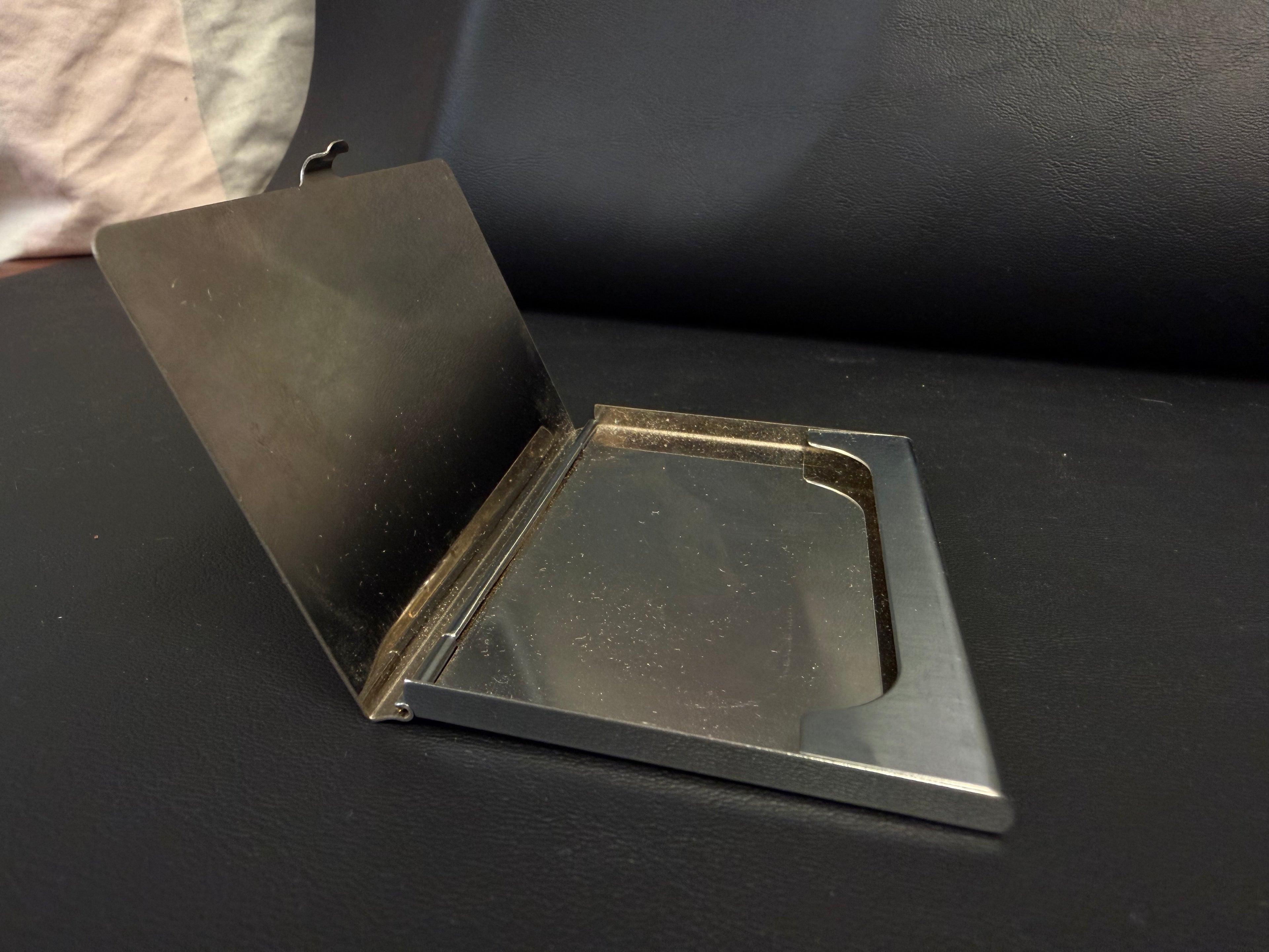 stainless steel business card holder featuring a polished mirror finish