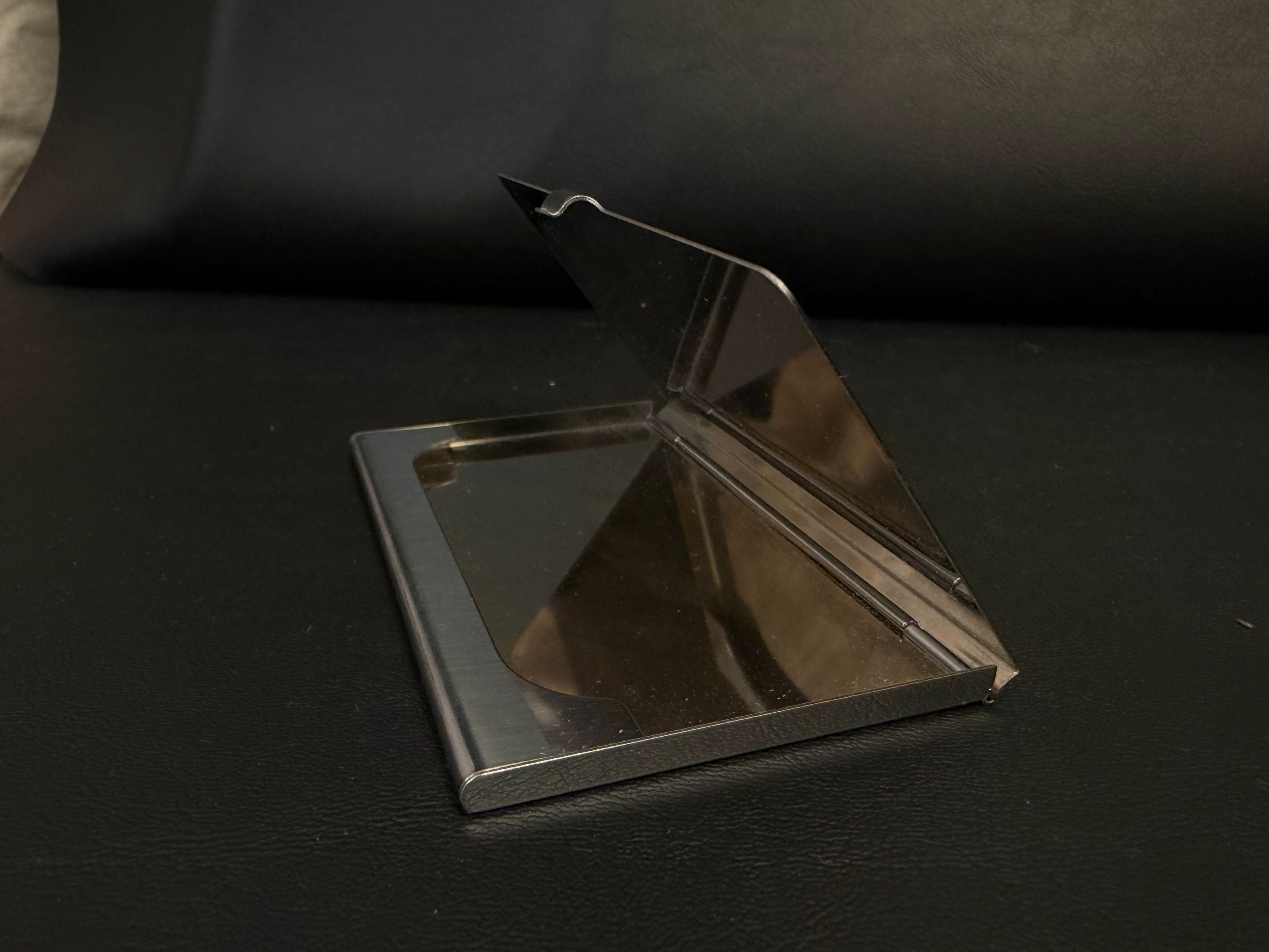 stainless steel business card holder featuring a polished mirror finish