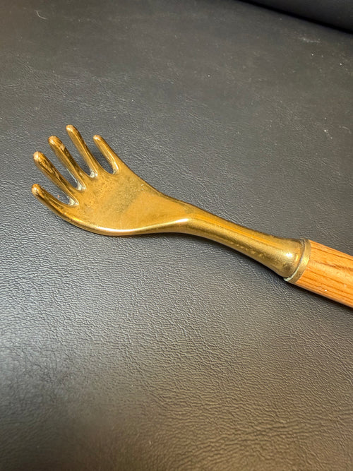 Brass back scratcher with wooded handle